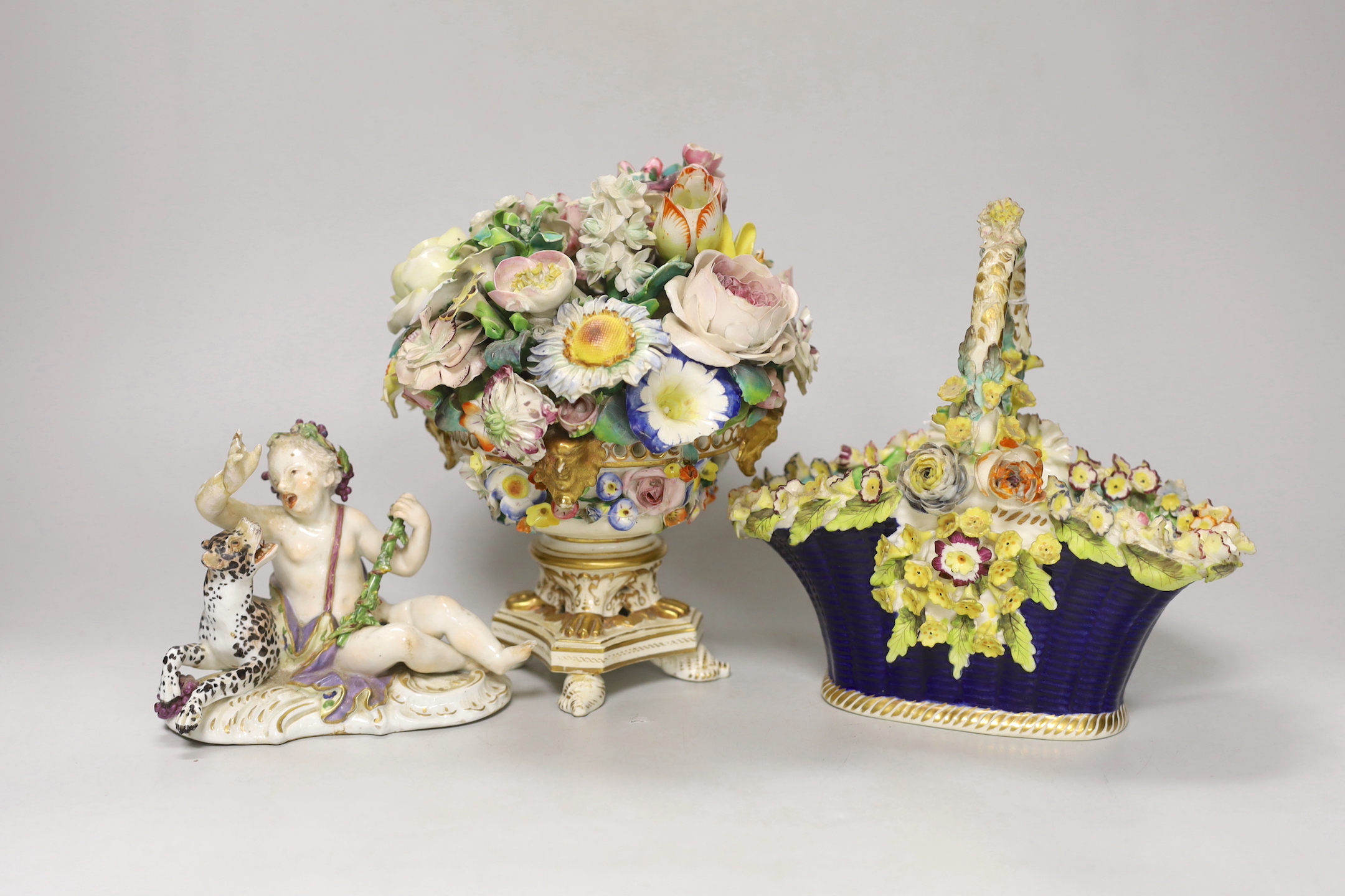 A Rockingham style floral encrusted basket, a Dresden floral centrepiece and a Meissen putti and leopard (a.f.), centrepiece 19cm high